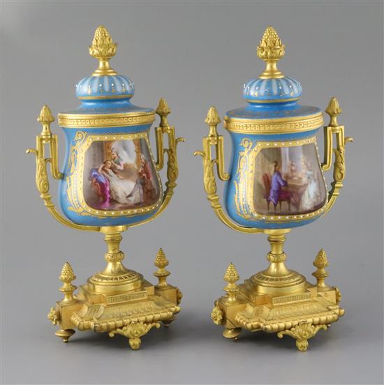 A pair of 19th century French ormolu mounted Sevres style porcelain urns, height 10.75in.